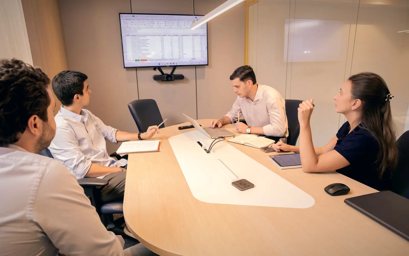 Executives meeting around a conference table in a corporate boardroom